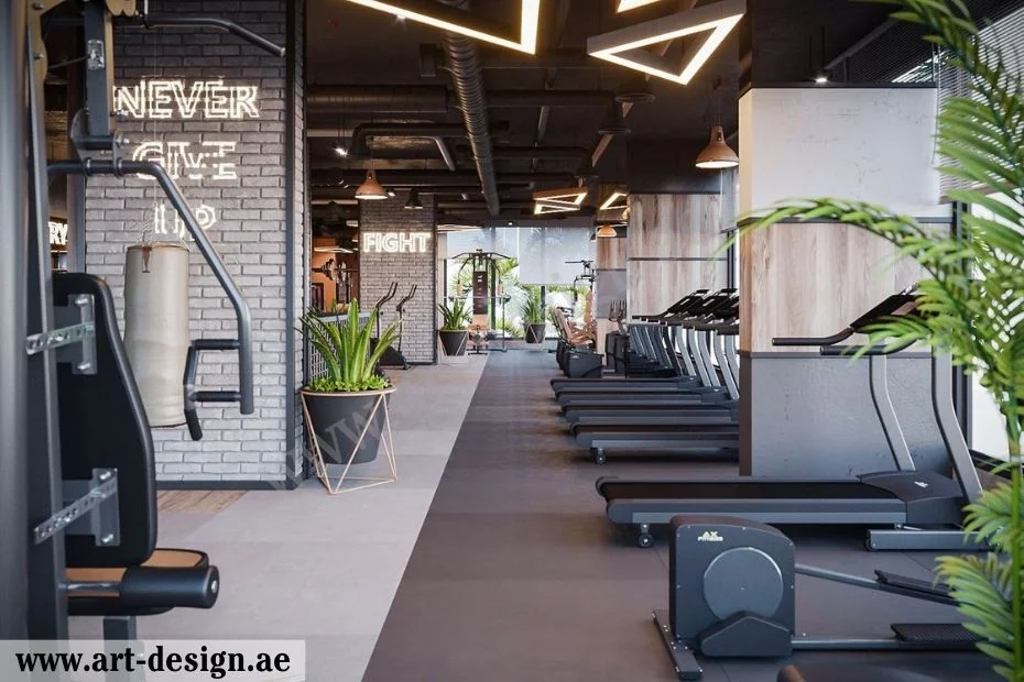 تصميم ديكورات صالات رياضية مميزة في الإمارات 3 إضافة إكسسوارات مميزة إلى الديكور، مثل المرايا الكبيرة أو النباتات